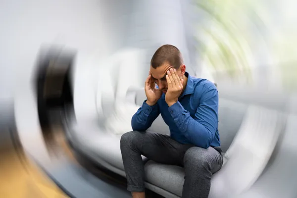 Patient receiving NUCCA upper cervical care for dizziness