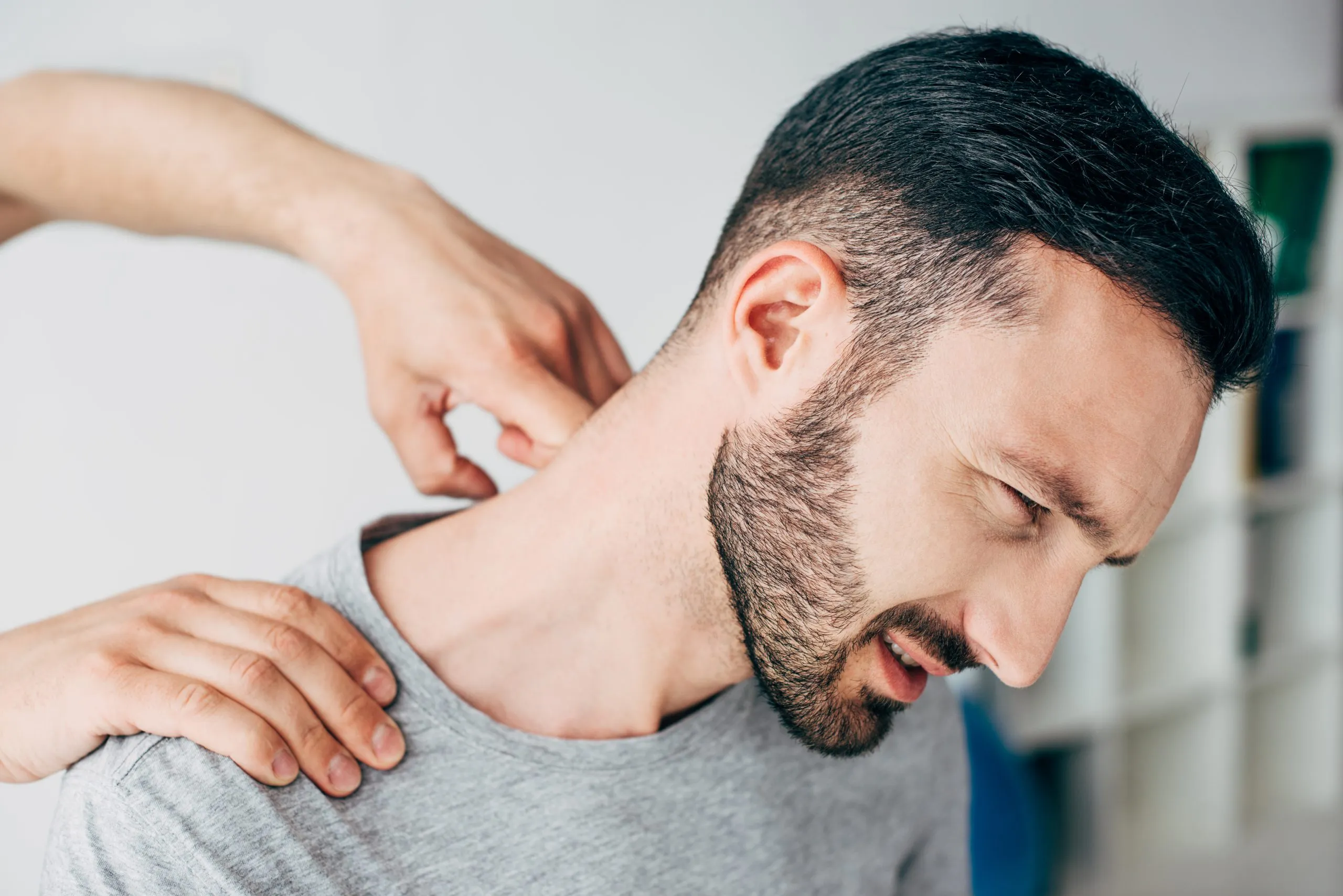 Patient receiving NUCCA upper cervical care for neck pain